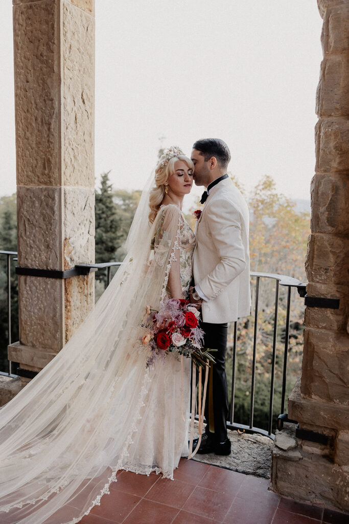 Bride and groom sharing a quiet moment on the panoramic terrace at La Baronia wedding venue in Barcelona Spain