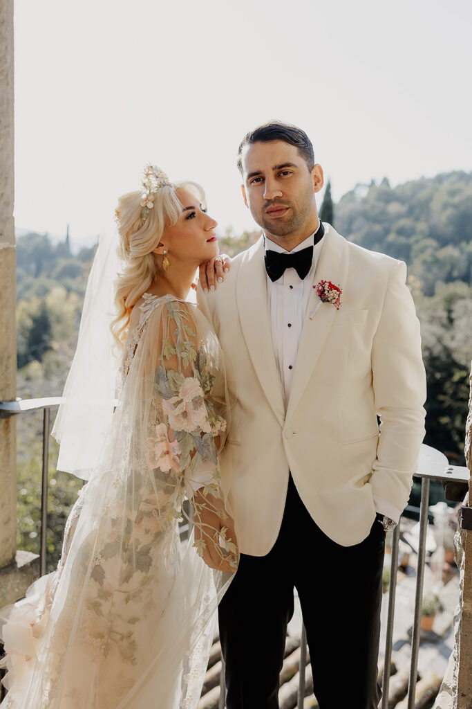 Romantic portrait of the bride and groom on the terrace at their La Baronia wedding venue in Barcelona Spain.