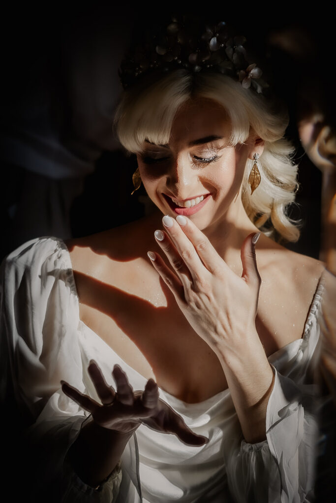 Bride admiring her wedding ring as she gets ready for the day.