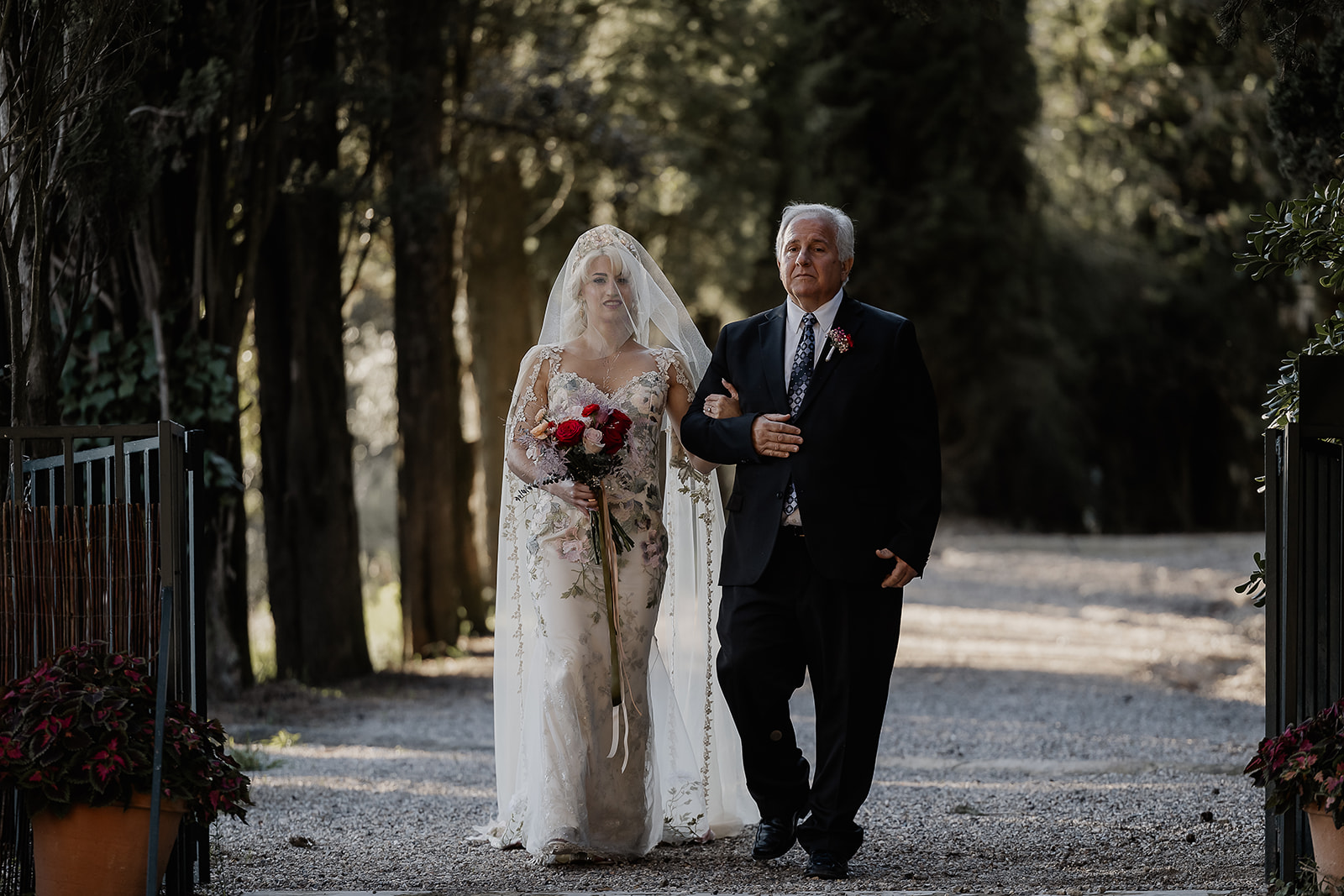 Bride being walked down the aisle by her father in Barcelona.