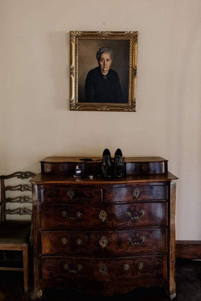 Grooms wedding details rested on a wooden dresser inside of La Baronia in Barcelona Spain.