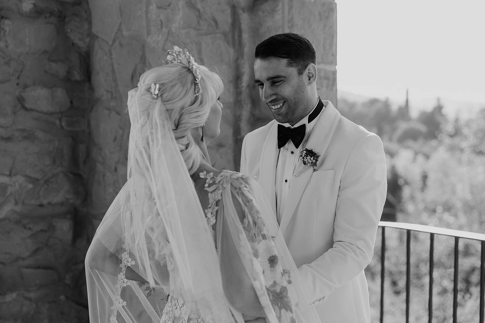 Bride and groom smiling together during their first look at a La Baronia wedding in Barcelona Spain.