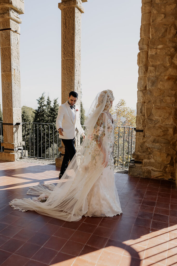 Groom admiring the bride during their first look on the panoramic terrace during their La Baronia wedding in Barcelona Spain.