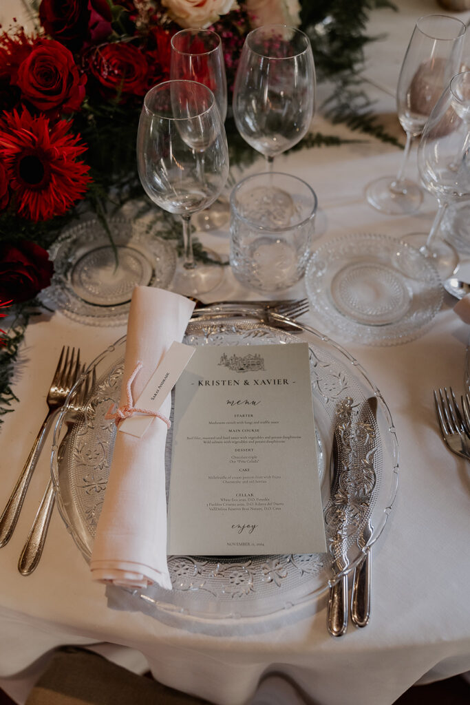 Close up photo of a reception table setting and menu. 