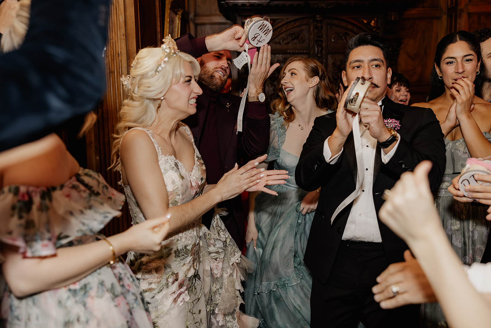 Bride dancing with guests during her wedding reception in Barcelona. 