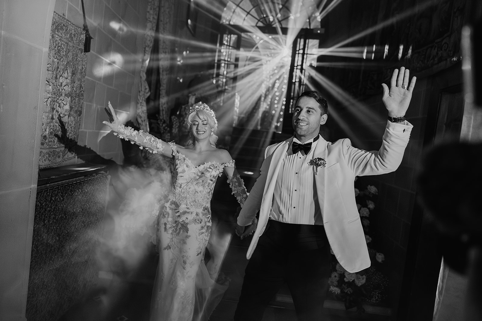 Bride and groom entering reception through fog and dramatic lighting at La Baronia wedding venue in Barcelona Spain