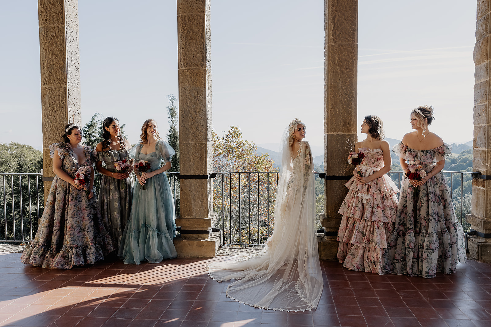 Bride and bridesmaids photos on the panoramic terrace of La Baronia wedding venue.