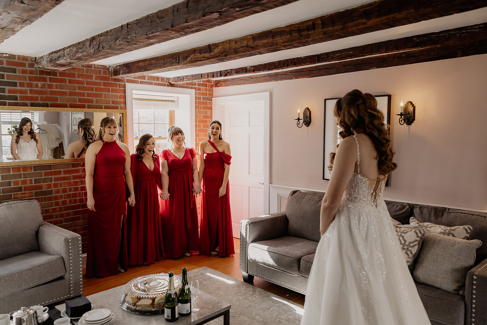 Bride sharing a first look with her bridesmaids at a farmhouse wedding in Hampton, NJ.