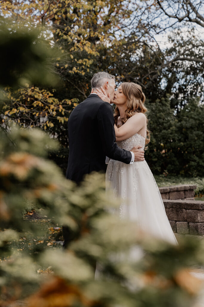Bride and groom kissing outdoors at a farmhouse wedding in Hampton, NJ.