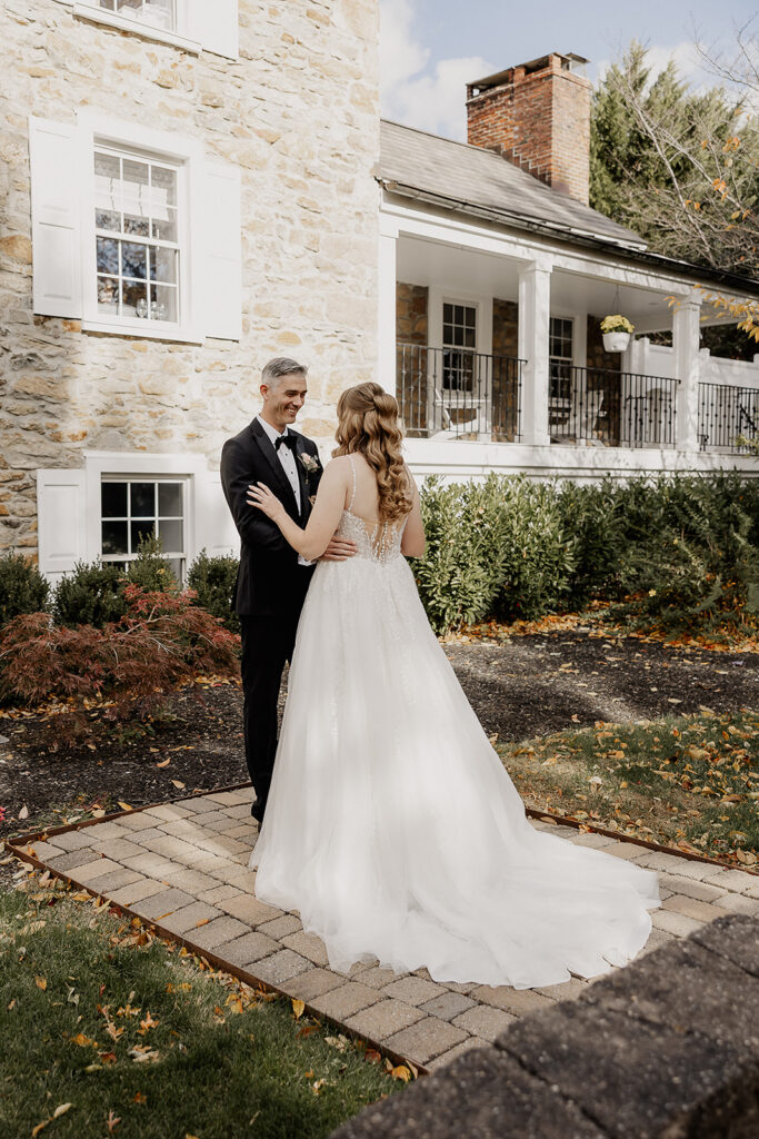 Bride and groom sharing their first look outdoors at a farmhouse wedding in Hampton, NJ.