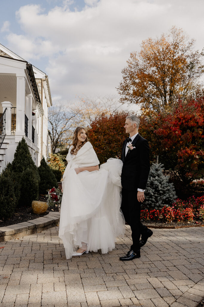 Bride and groom walking the grounds at The Farmhouse wedding venue in Hampton, NJ.