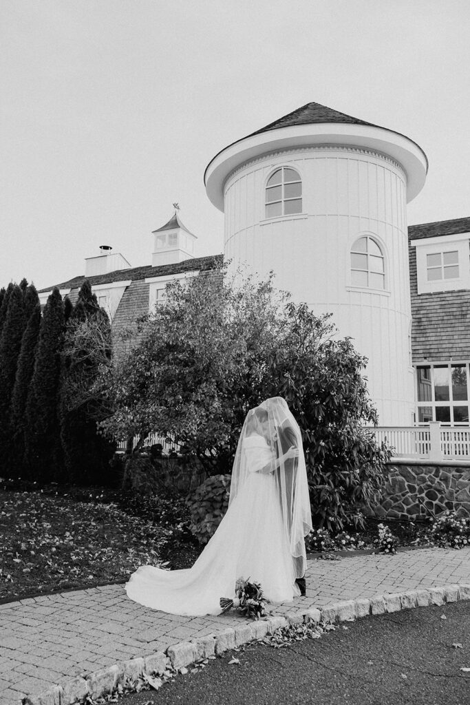 Black and white portraits of a bride and groom posing outside of The Farmhouse wedding venue in Hampton, NJ.