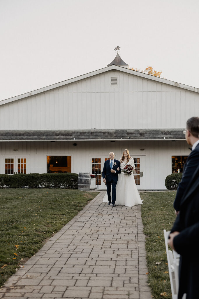 Bride walking down the aisle with her father.