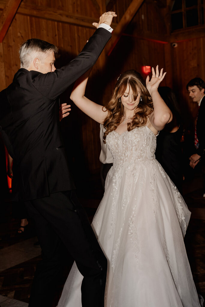 Bride and groom dancing together during reception at The Farmhouse wedding venue in Hampton, NJ.