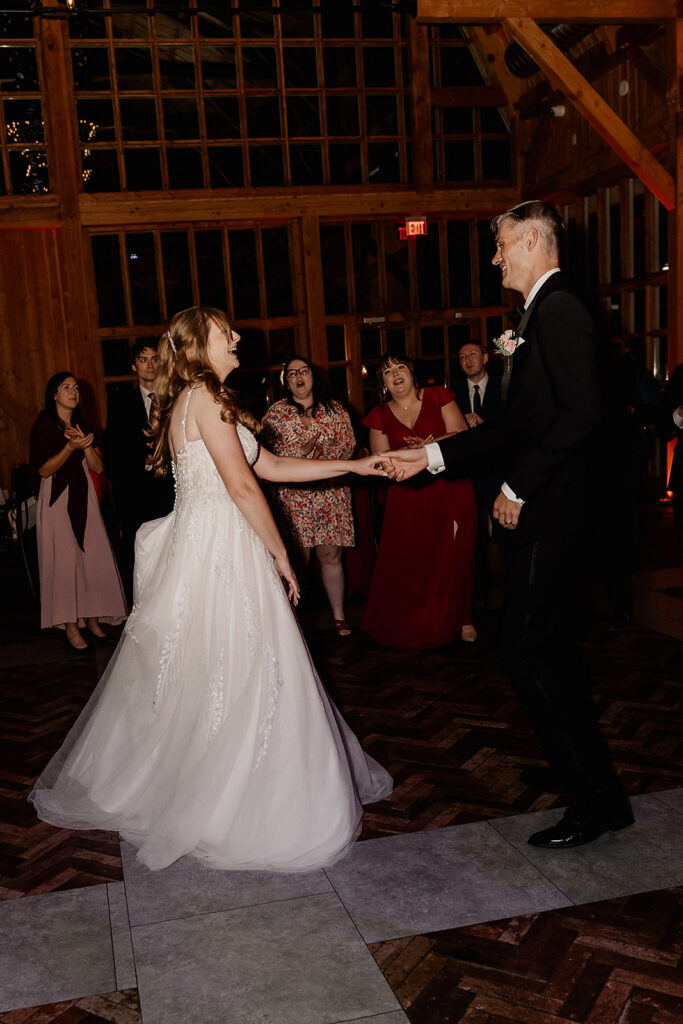 Bride and groom dancing together during reception at The Farmhouse wedding venue in Hampton, NJ.