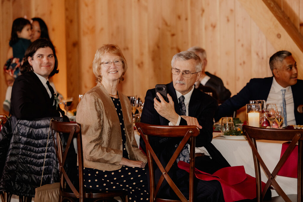 Guests taking photos during the reception.