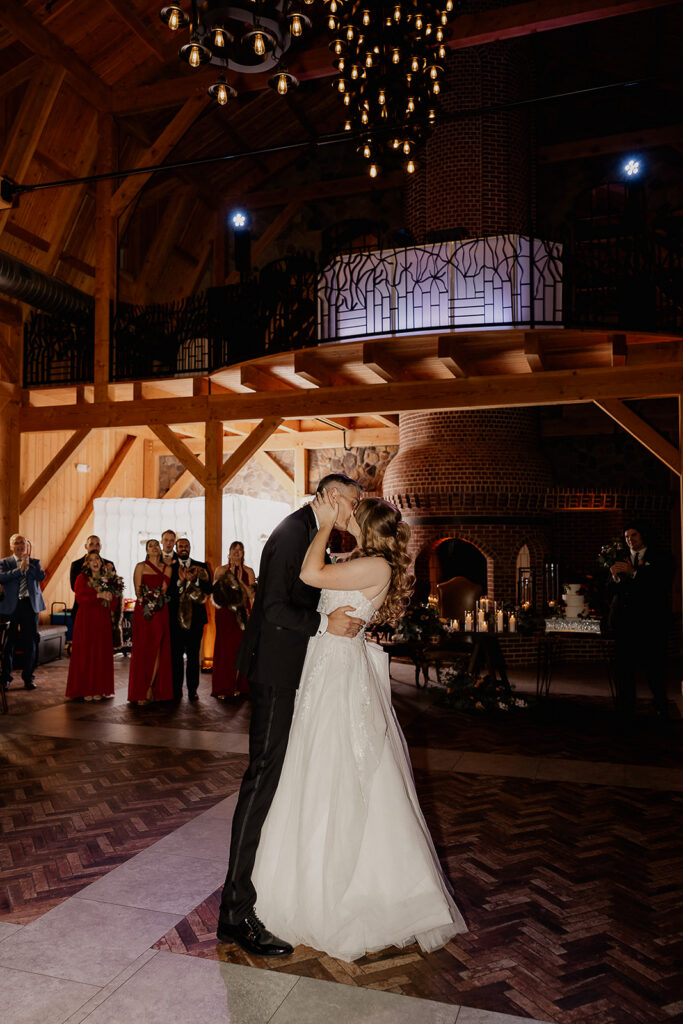 Bride and groom kissing during their first dance at The Farmhouse wedding venue in Hampton NJ.
