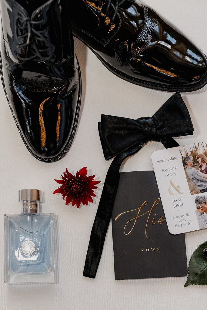 Flatlay shot of the grooms wedding details.