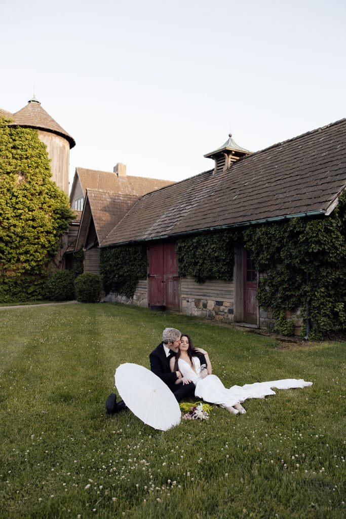 Couple sitting on the lawn at Jardin de Buis in New Jersey.