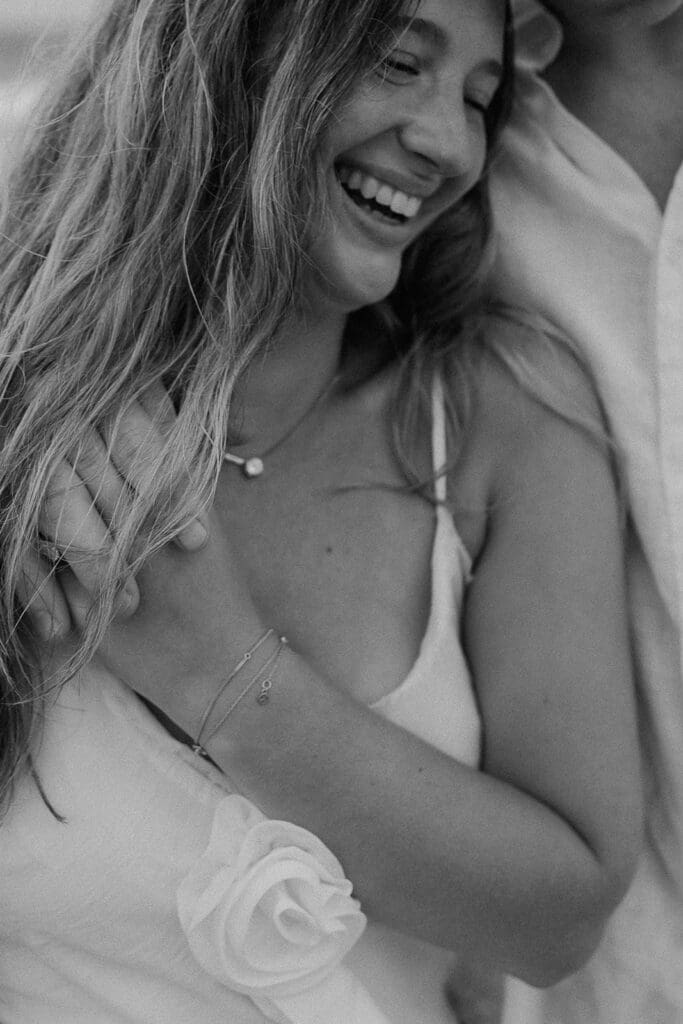 Candid black and white close up shot of a couple having fun during their photo session. 