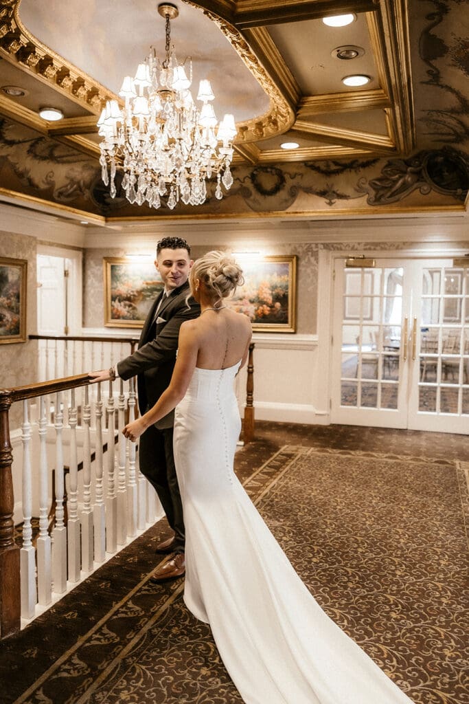 Groom turning around to see his bride during their first look at The Brownstone in Paterson, NJ.