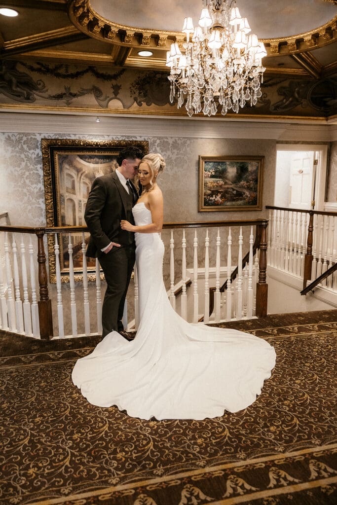 Bride and groom posing together at The Brownstone in Paterson, NJ.