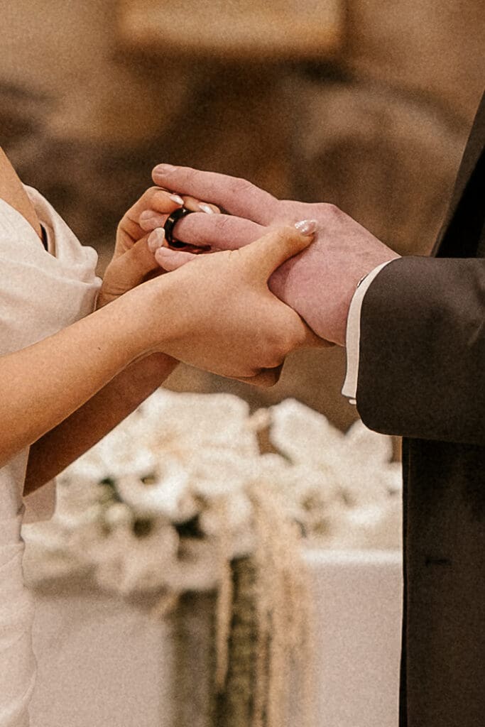 Bride and groom exchanging rings during their wedding ceremony at St. Mary’s Church in Pompton Lakes, NJ.