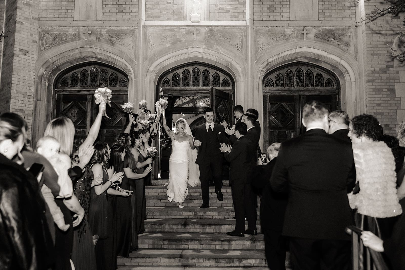 Bride and groom exiting St. Mary’s Church in Pompton Lakes, NJ after their wedding ceremony.