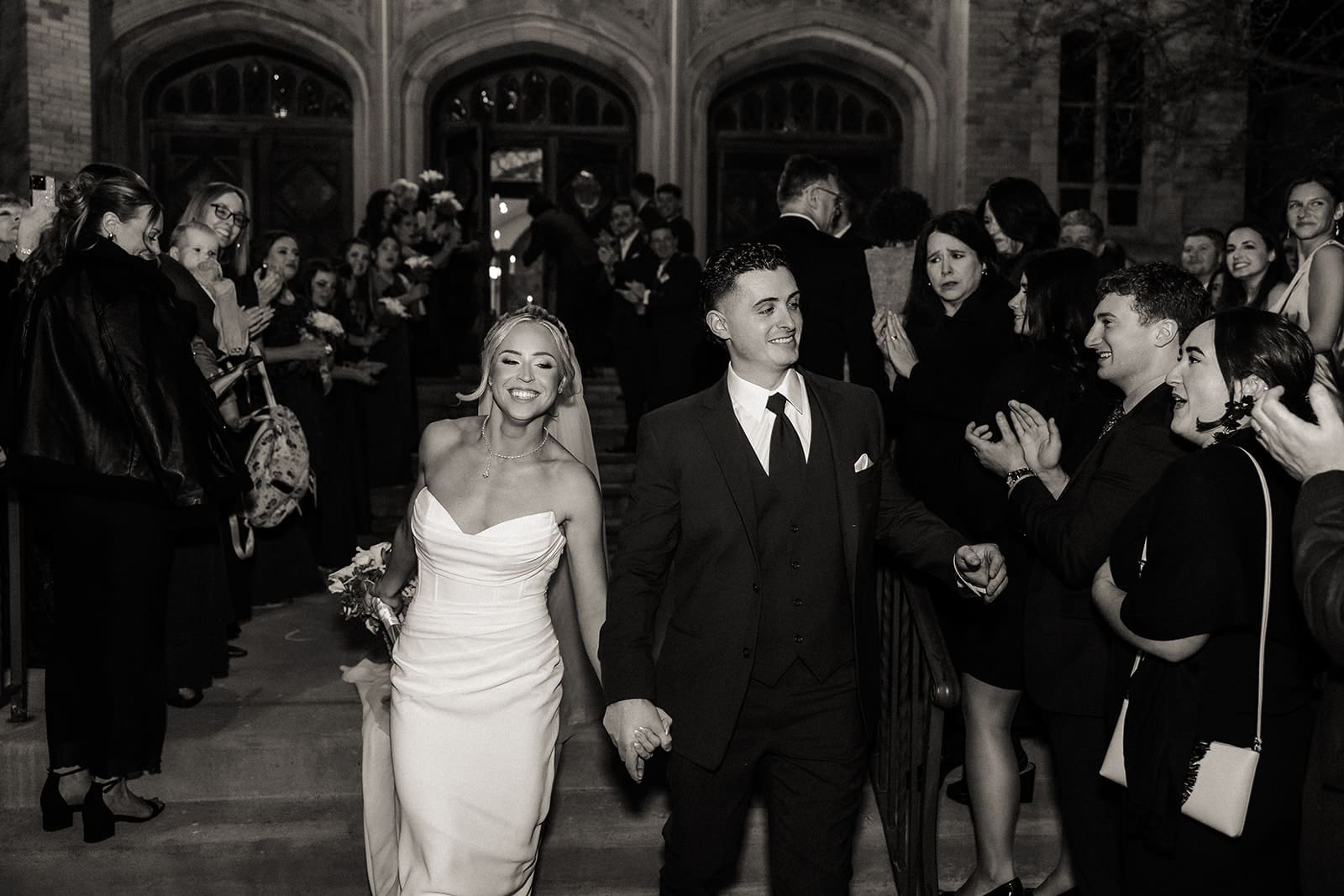 Bride and groom smiling during their church exit at St. Mary’s Church in Pompton Lakes, NJ.