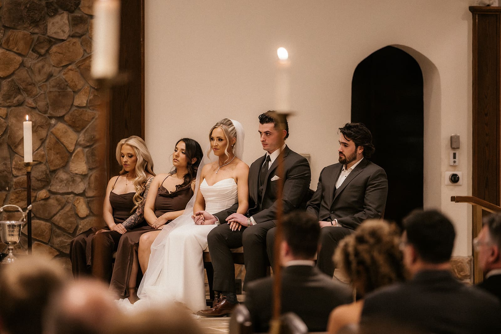 Bride and groom sitting together during their Catholic wedding ceremony at St. Mary’s Church in Pompton Lakes, NJ.