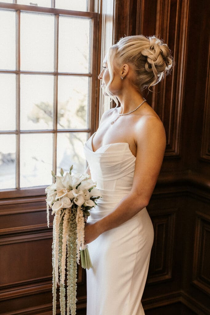 Indoor bridal portraits by a window at The Brownstone in Paterson, NJ.