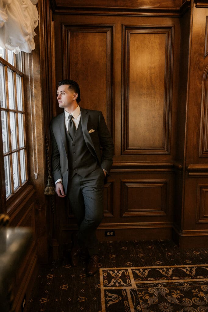 Indoor grooms portraits by a window at The Brownstone in Paterson, NJ.