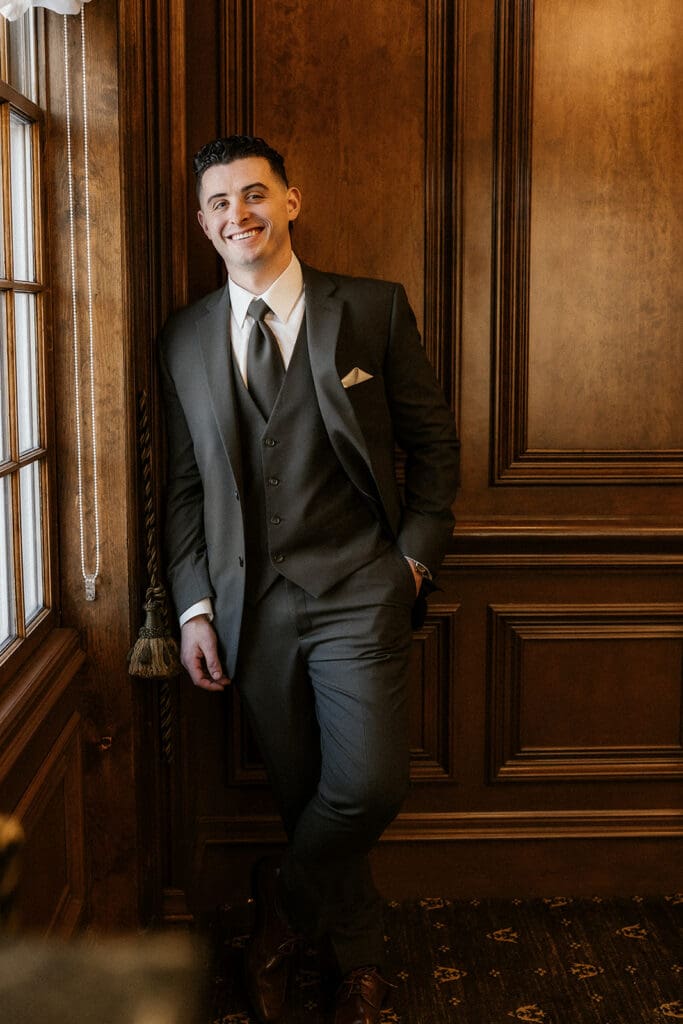 Indoor grooms portraits by a window at The Brownstone in Paterson, NJ.