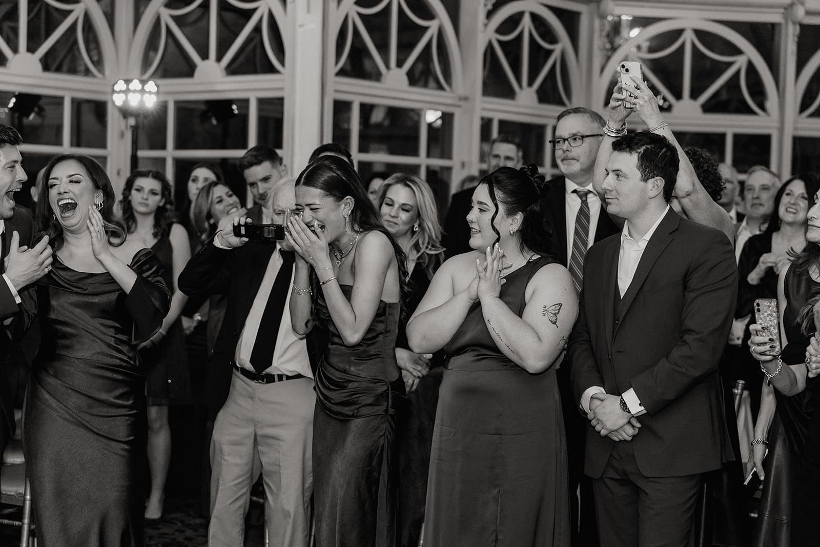 Wedding guests reacting during emotional family dances at The Brownstone in Paterson, NJ.