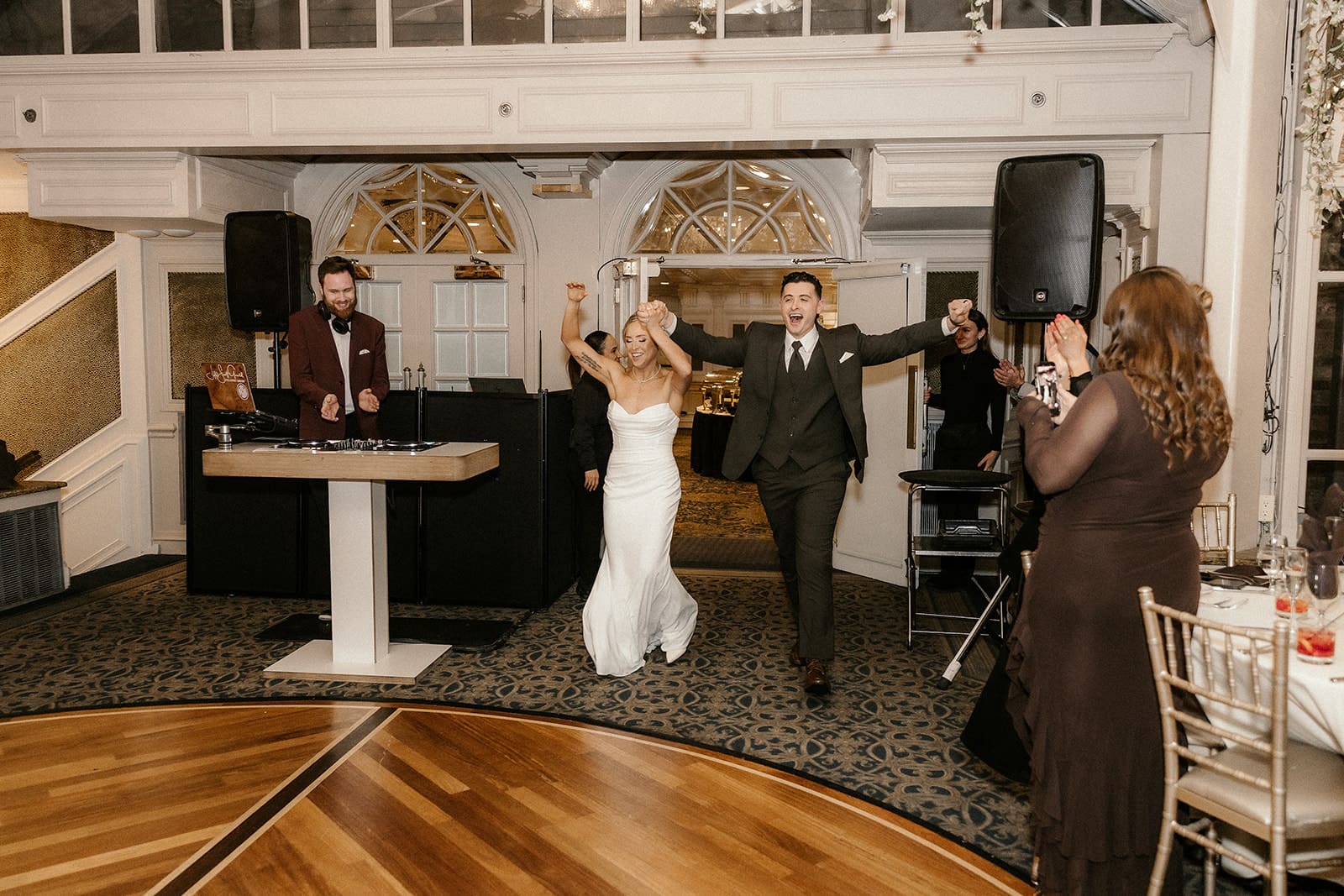 Bride and groom entering their reception at The Brownstone in Peterson, NJ.