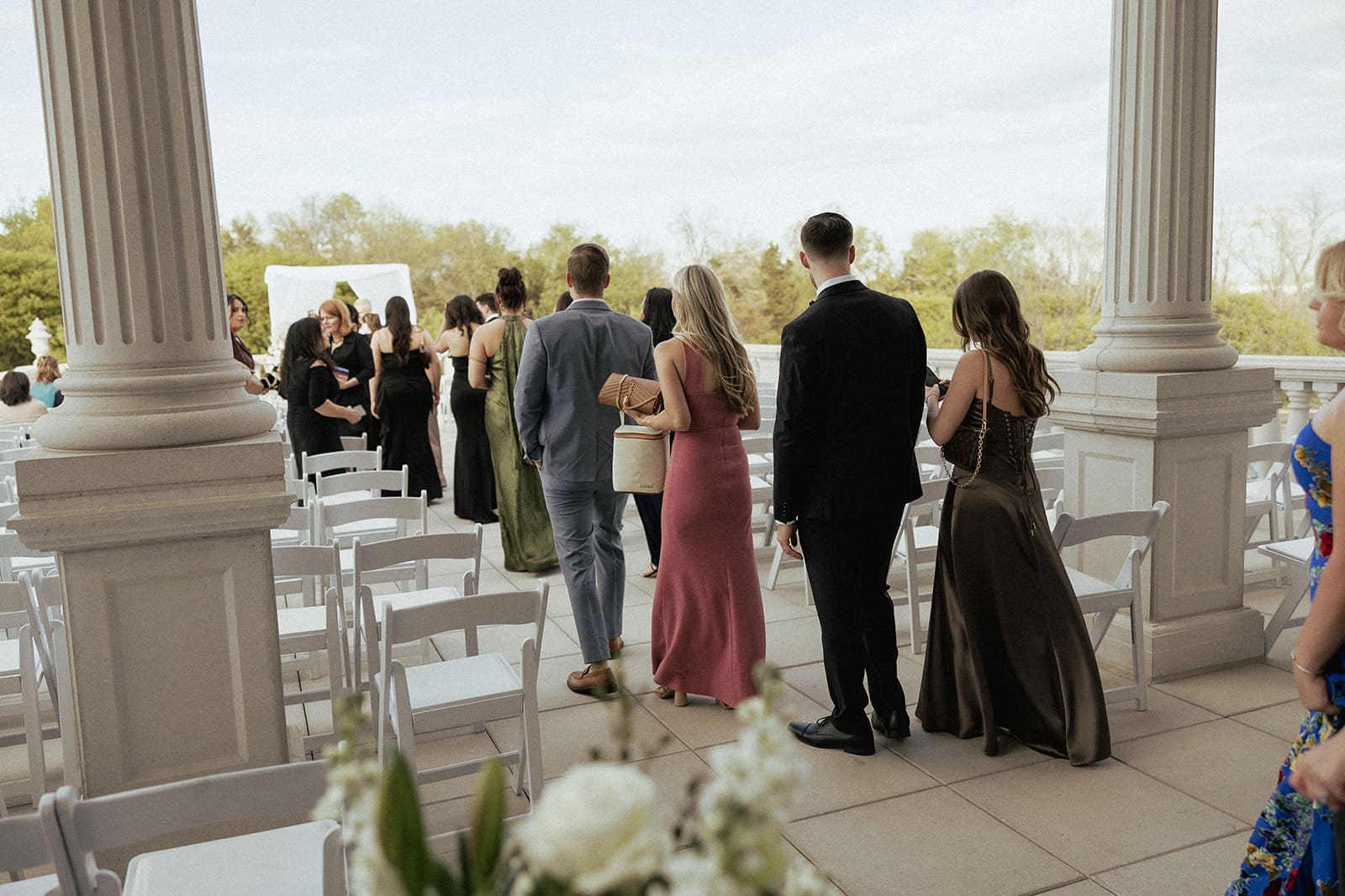 Wedding guests walking out to sit for the ceremony.