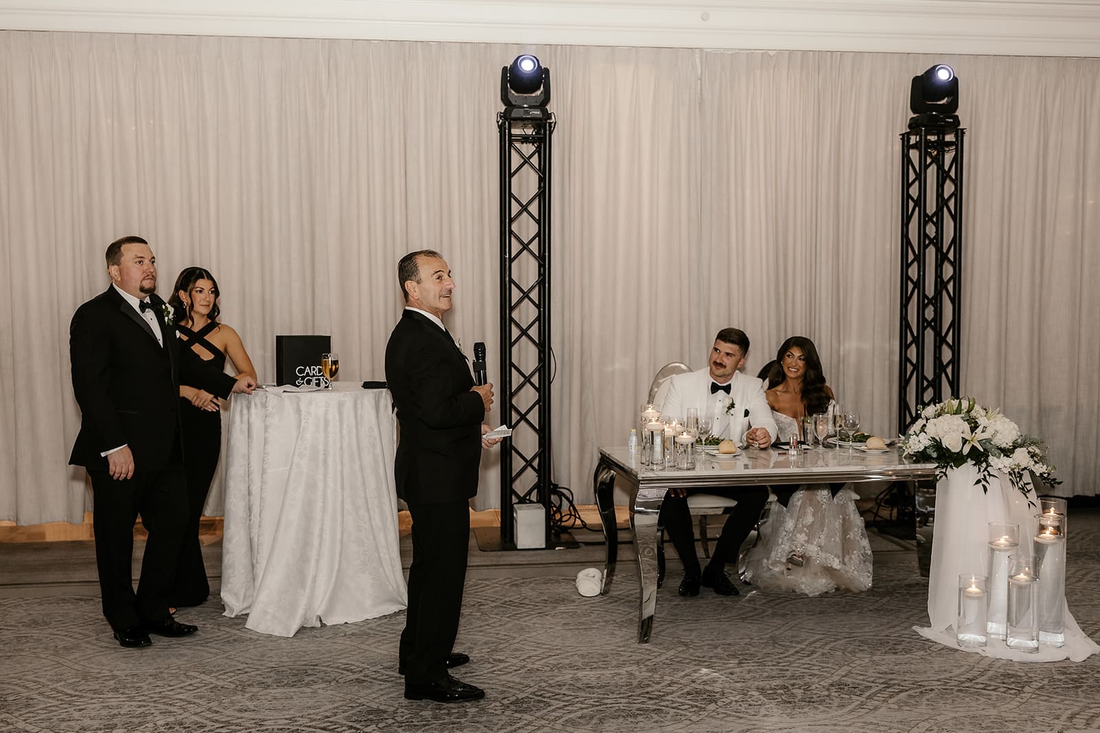 Father of the bride giving a speech during the reception.