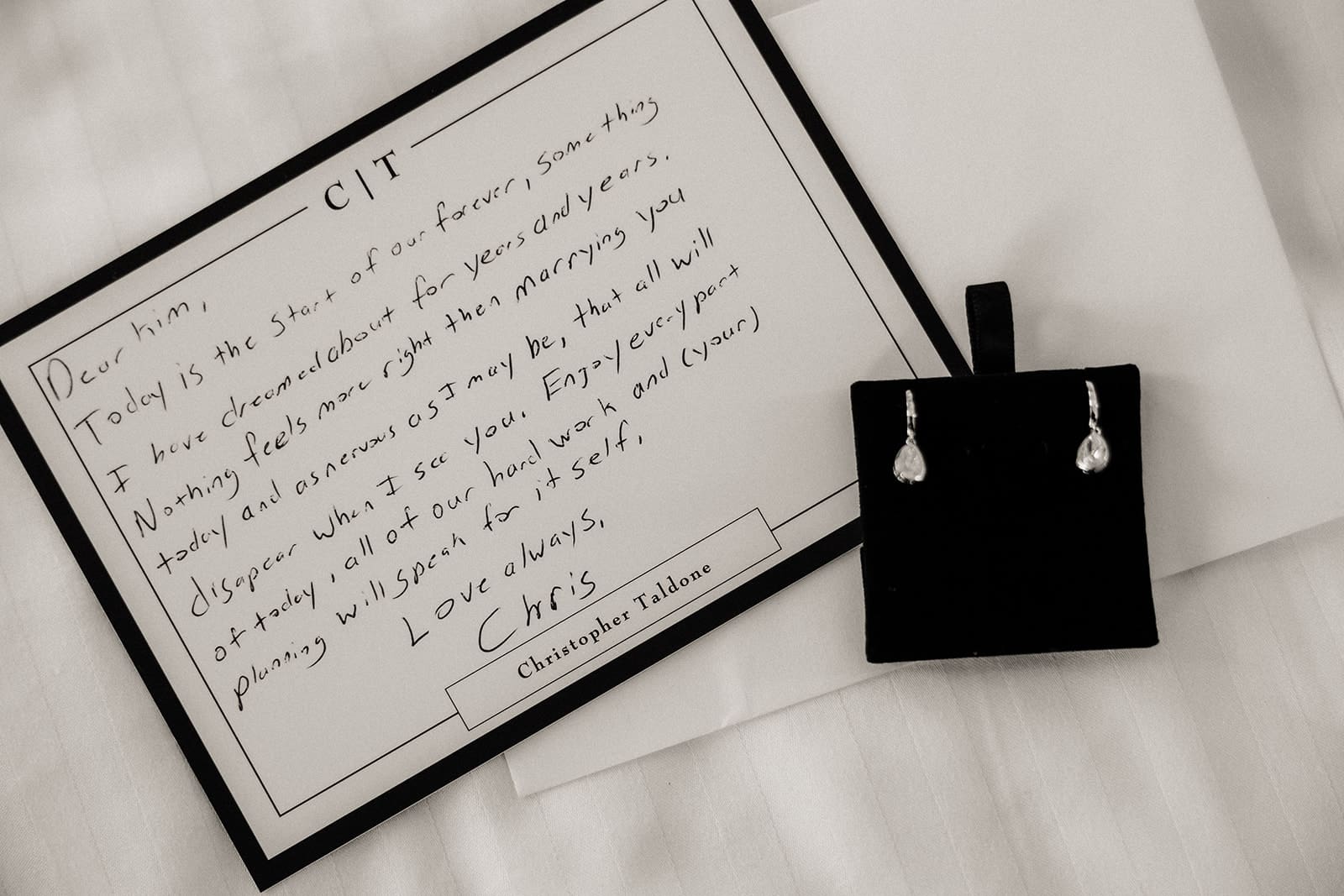 Black and white photo of a letter to the bride from the groom.