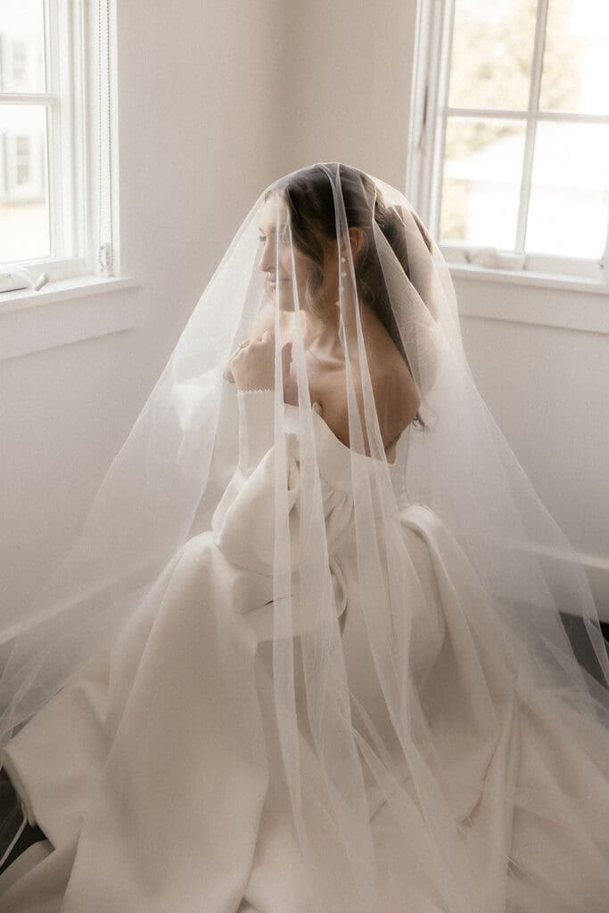 Dramatic indoor bridal portraits under a veil at The Ryland Inn wedding venue.
