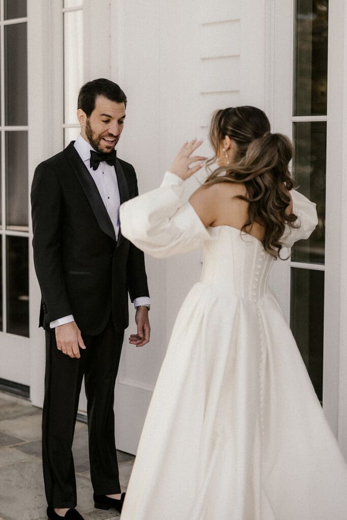 Groom seeing his bride for the first time during their first look.