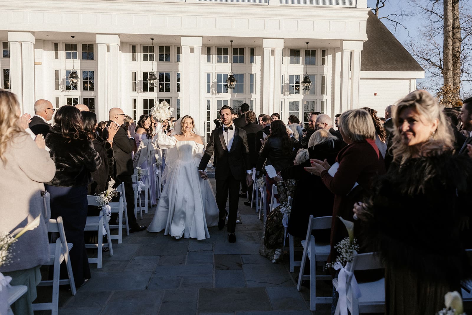 Bride and groom walking back down the aisle after their ceremony at The Ryland Inn.