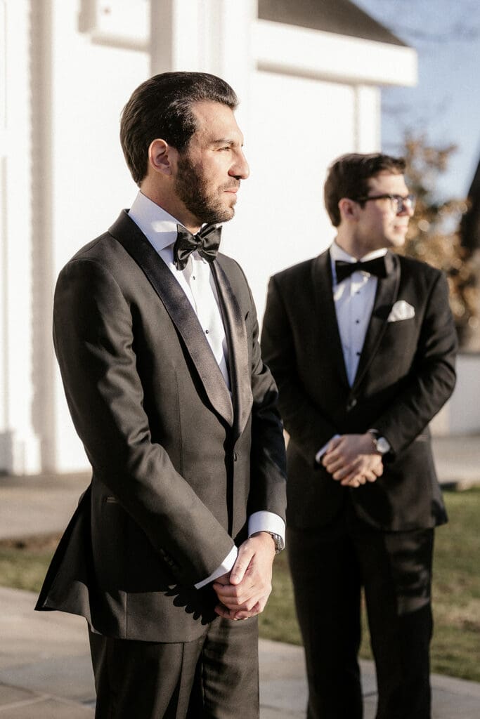 Groom waiting outside before the ceremony at The Ryland Inn wedding venue.