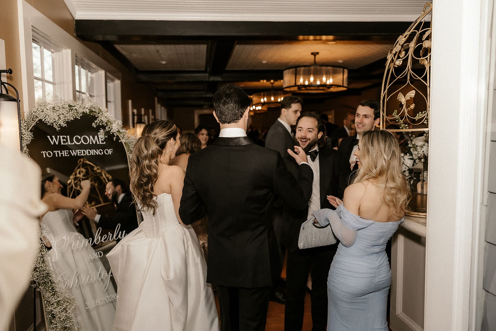 Bride and groom mingling with guests during cocktail hour.