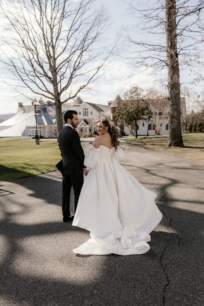 Bride and groom walking outside towards The Ryland Inn wedding venue in White House Station, NJ.