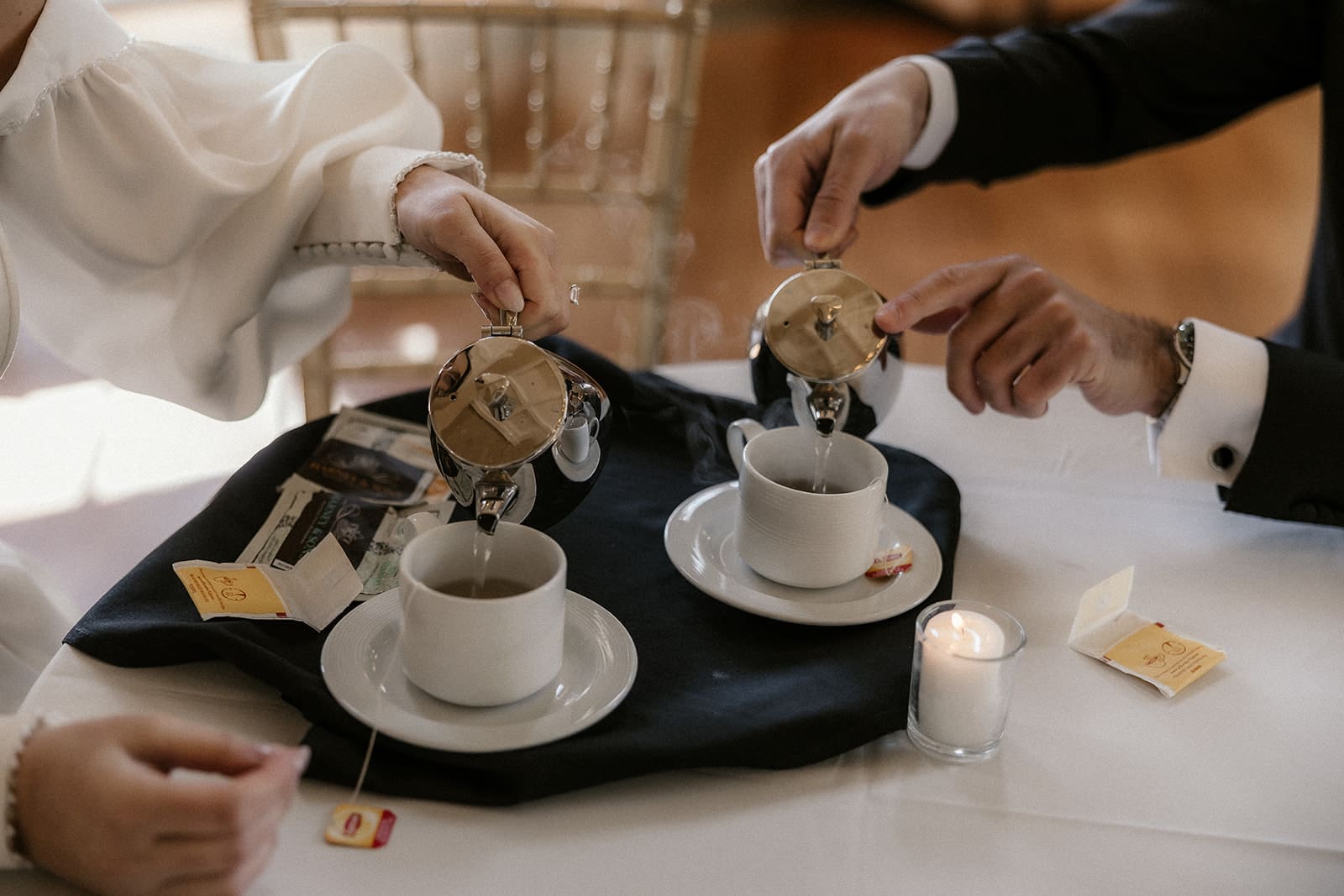 Bride and groom having tea together before their wedding ceremony at The Ryland Inn.
