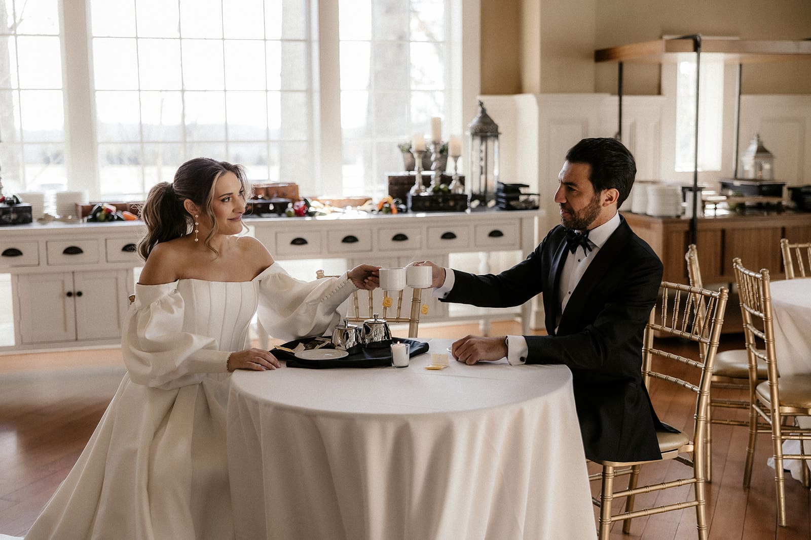 Bride and groom having tea together before their wedding ceremony at The Ryland Inn.