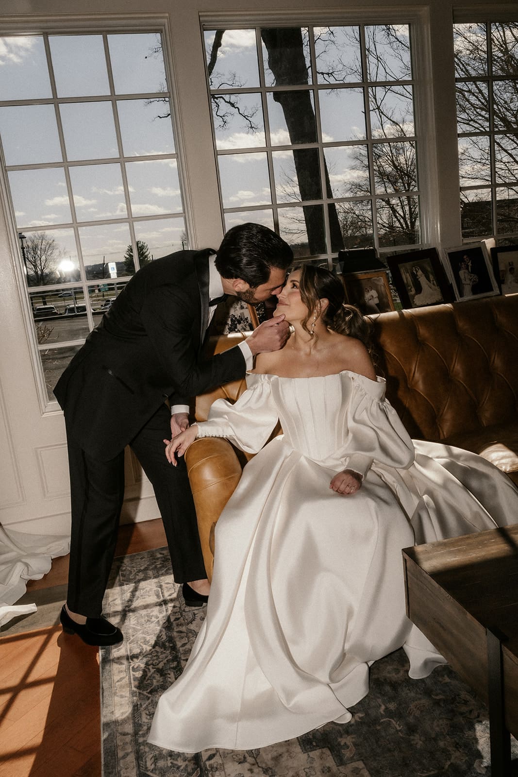 Flash photo of a bride and groom kissing inside The Ryland Inn wedding venue.