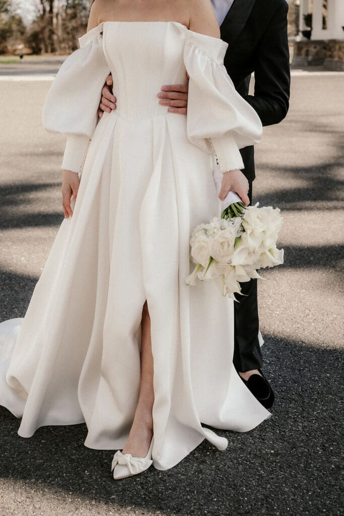 Close up portrait of a bride and groom posing together outside of The Ryland Inn wedding venue in White House Station, NJ.
