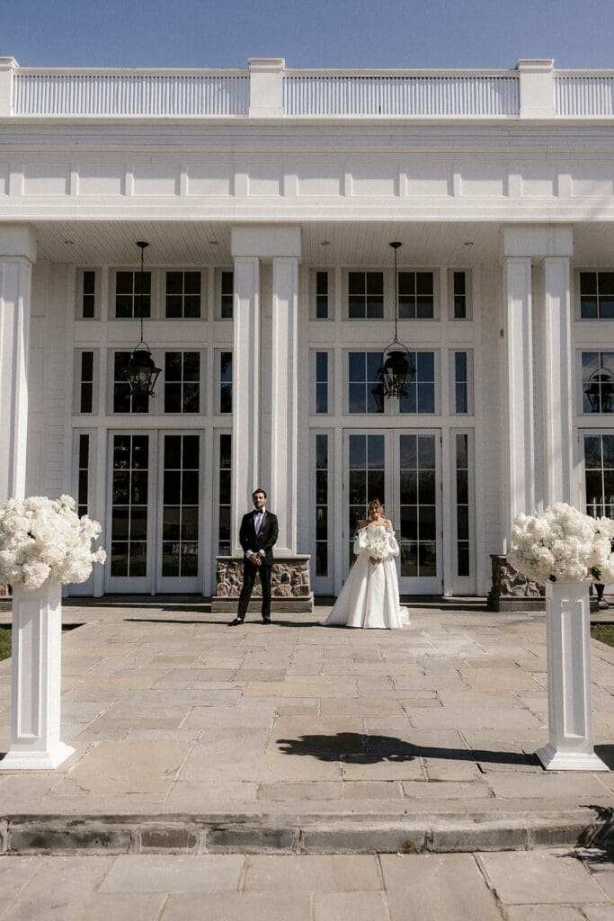 Bride and grooms editorial style portrait outside The Ryland Inn wedding venue in White House Station, NJ.