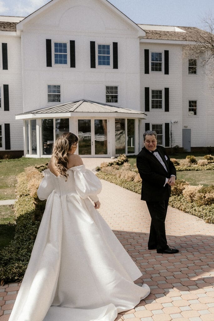 Bride sharing a first look with her father.